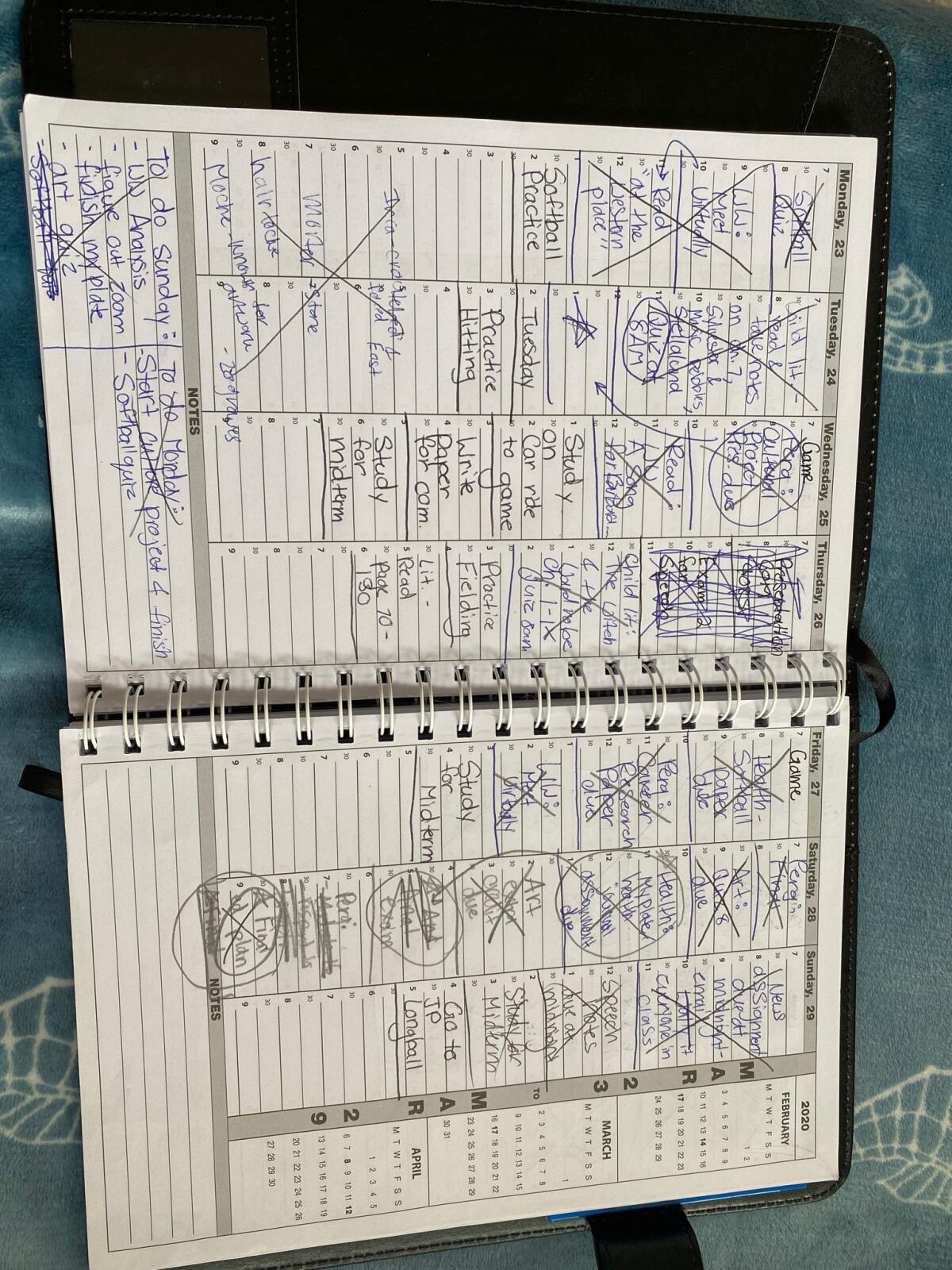 Savannah Ames' planner is full to keep track of her 24 units and softball events.