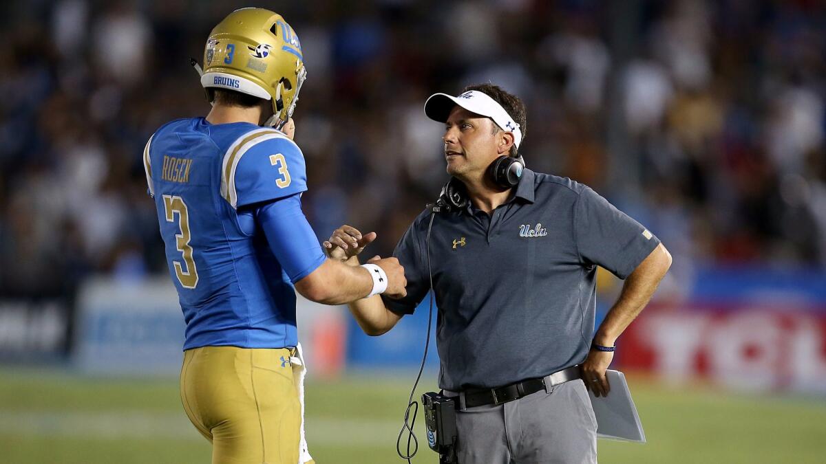 UCLA offensive coordinator Jedd Fisch talks with quarterback Josh Rosen during the game against Texas A&M on Sunday, Sept. 3, 2017.