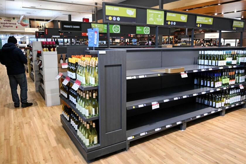 Empty space on shelves where American-made wine had been at the Societe Des Alcools Du Quebec (SAQ) store in Montreal, Quebec, Canada, on Wednesday, March 5, 2025. Prime Minister Justin Trudeau is not open to lifting Canada's full package of retaliatory tariffs if US President Donald Trump leaves any tariffs on Canada in place, according to a senior Canadian government official. Photographer: Graham Hughes/Bloomberg