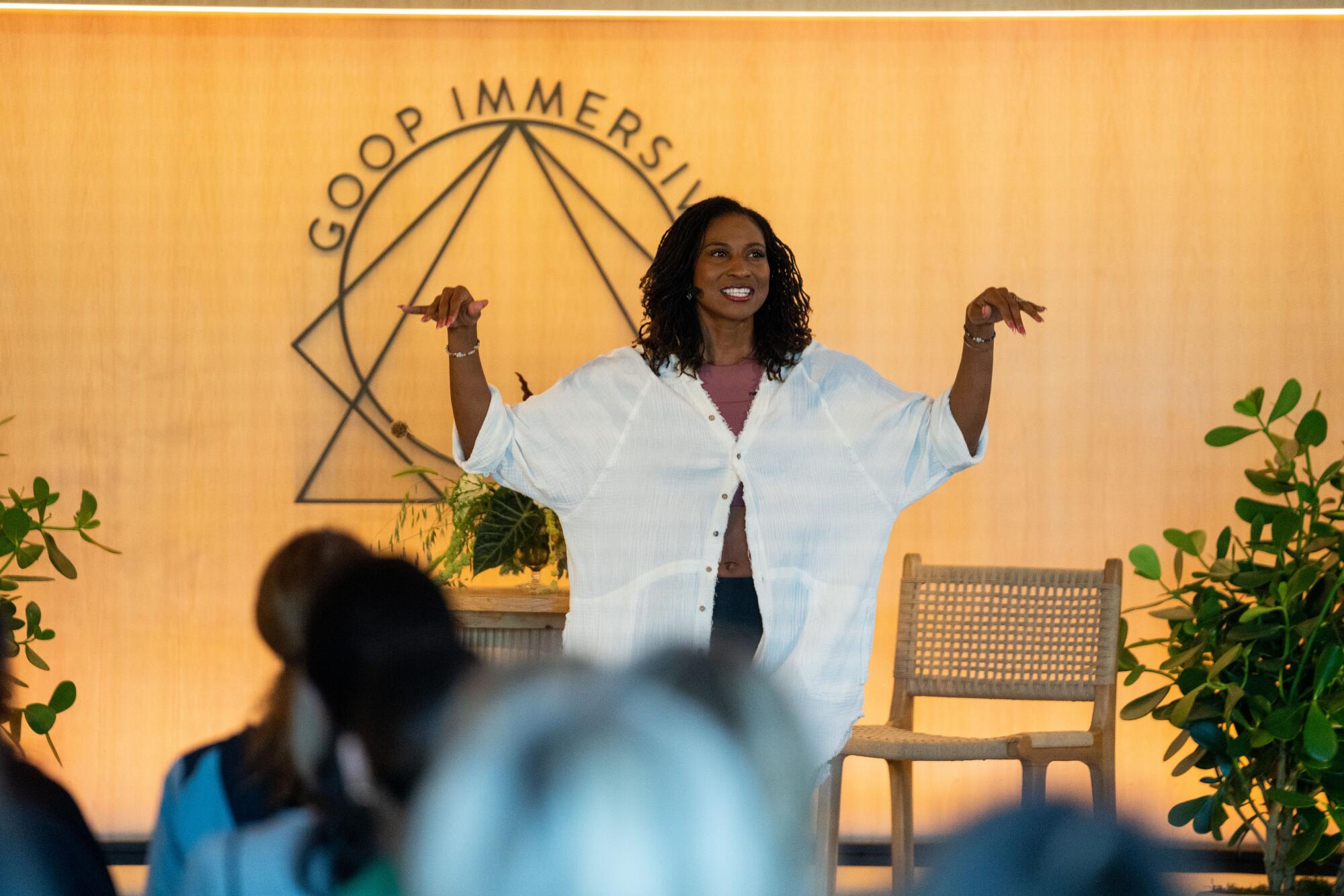 Koya Webb, a yoga teacher and holistic and wellness coach, speaks at the Goop Immersive event in Santa Monica.
