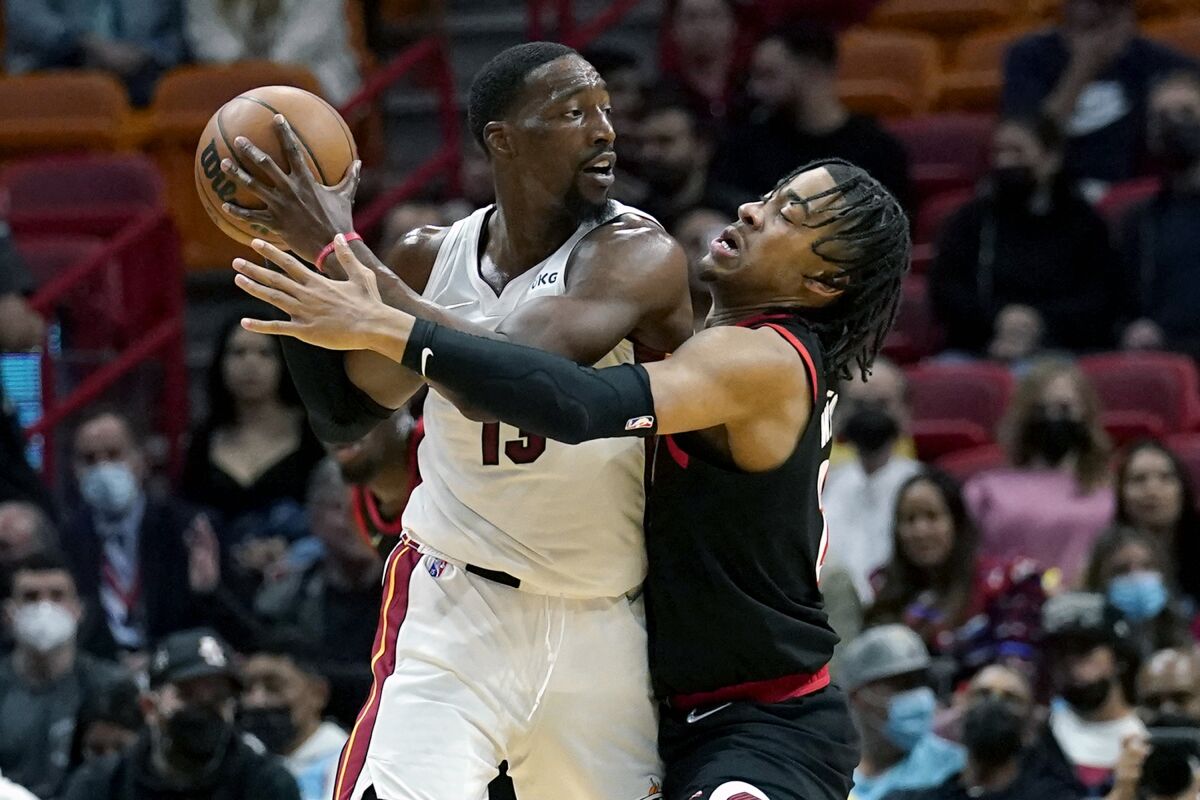 Portland Trail Blazers forward Trendon Watford, right, defends Miami Heat center Bam Adebayo (13) during the first half of an NBA basketball game, Wednesday, Jan. 19, 2022, in Miami. (AP Photo/Lynne Sladky)