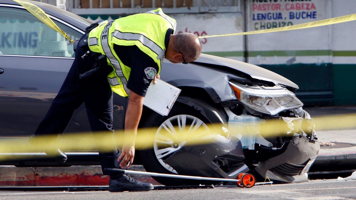 A crash scene in Koreatown in 2014 where a pedestrian was killed. Last year, 260 people were killed in L.A. traffic collisions, an increase of almost 43% over the prior year.