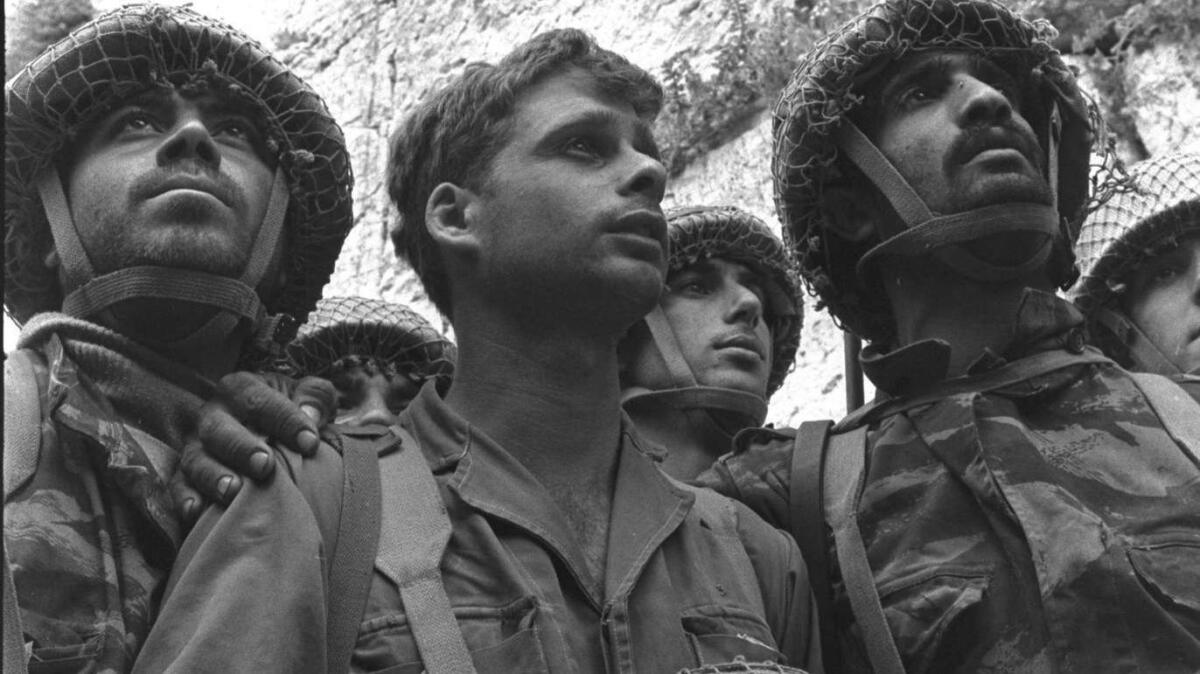 In an iconic image, Israeli paratroopers stand at the Western Wall in 1967.