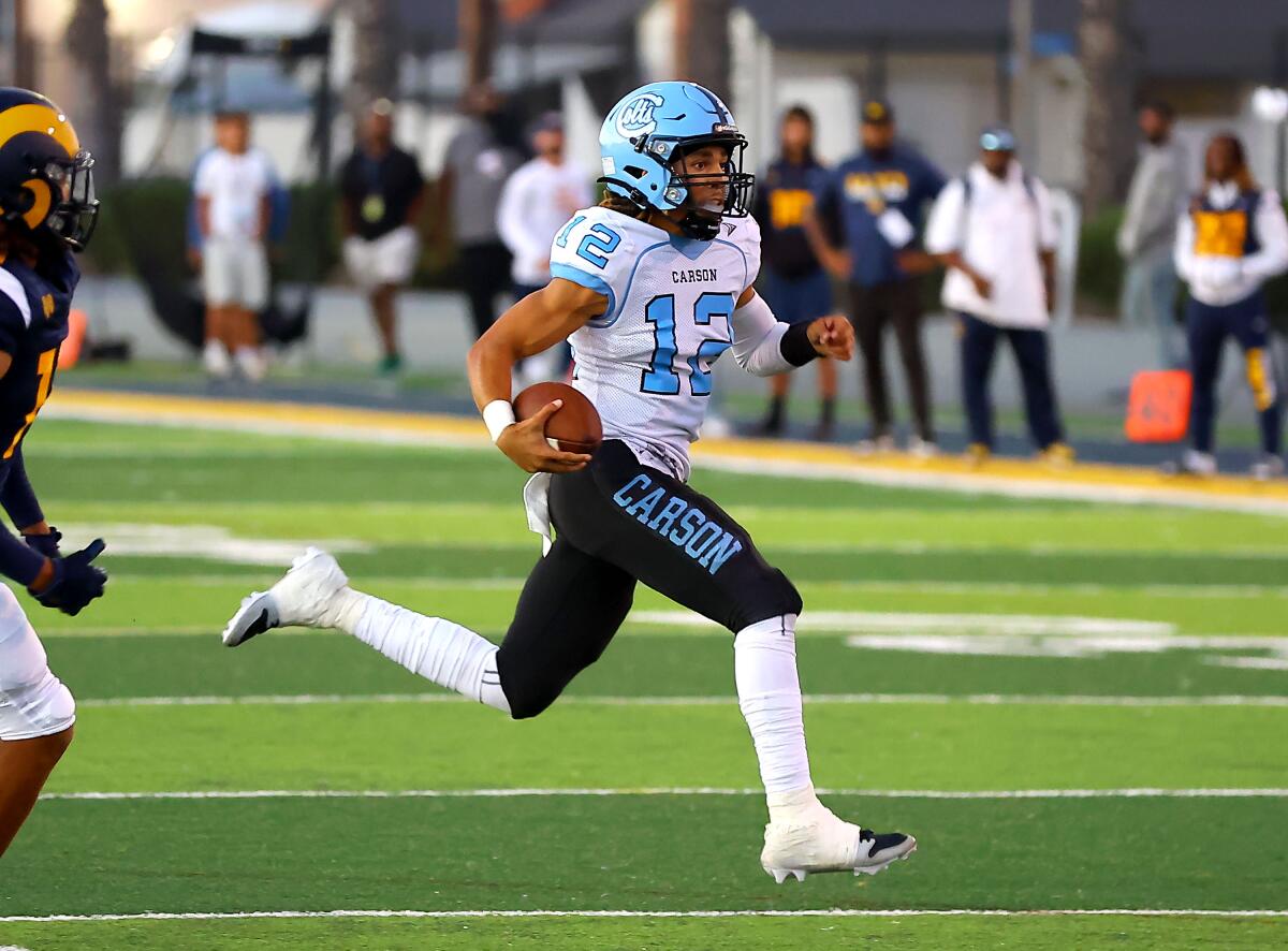 Carson quarterback Chris Fields runs for a gain.