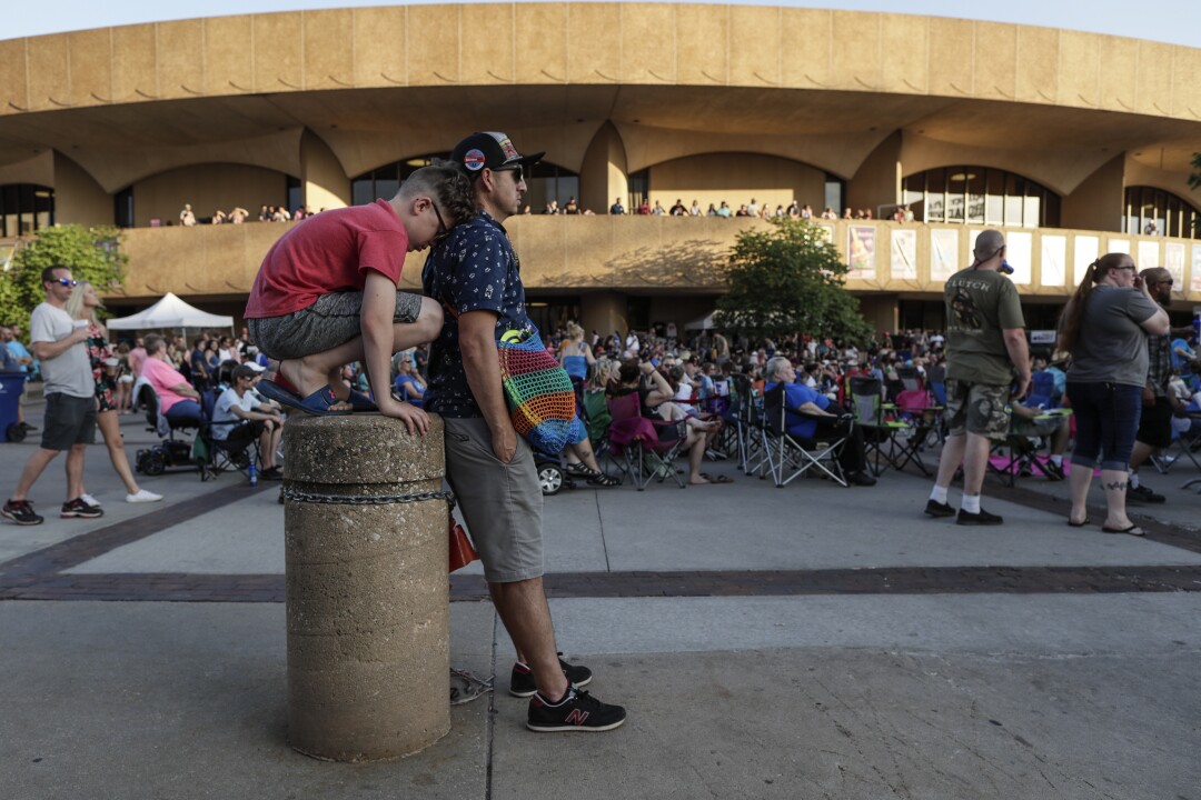 Franklin and his son Evan, from Dodge City view a concert near the Century II Performing Arts & Convention Center.