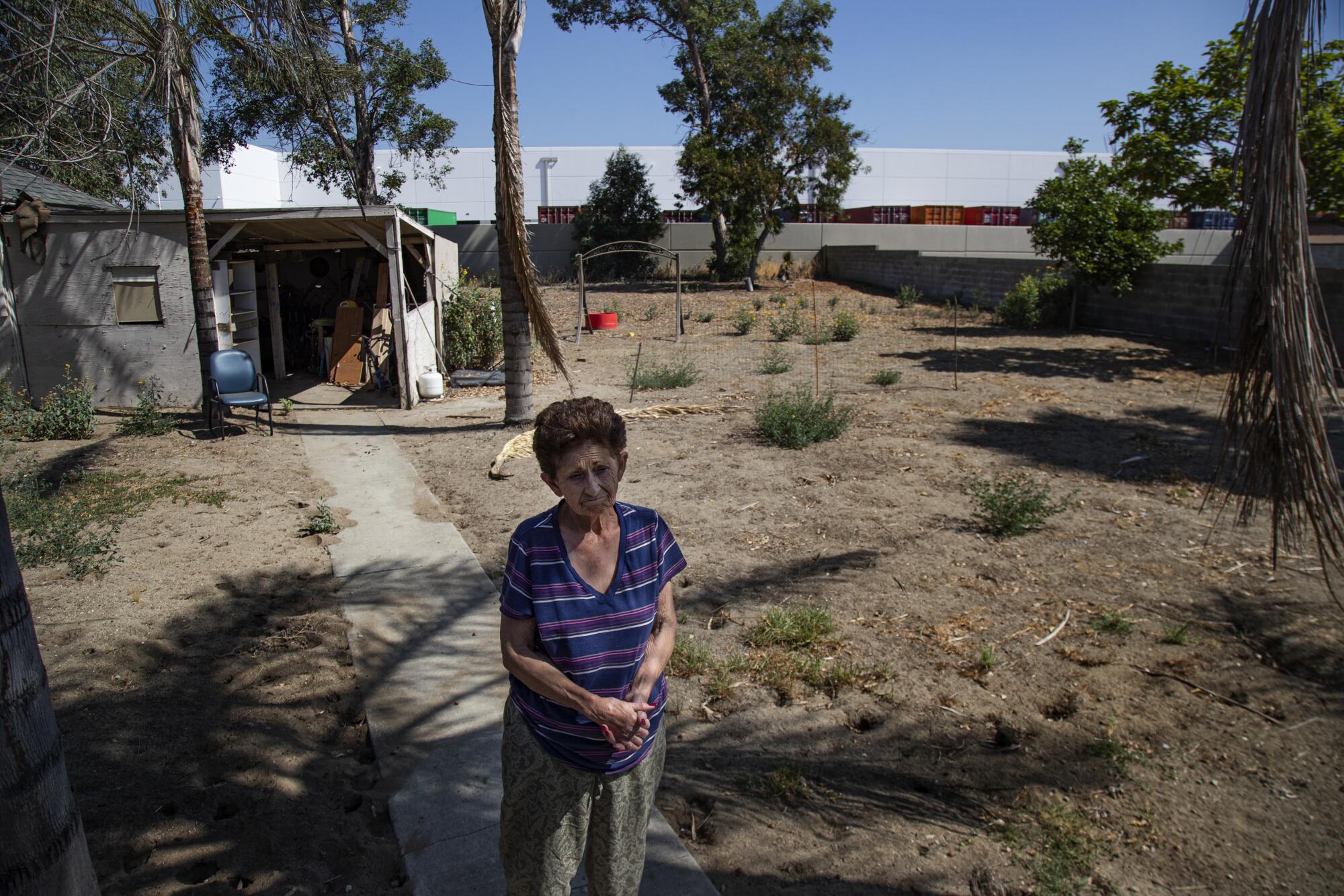 Mary Anita Valdepeña in the backyard of her Fontana home