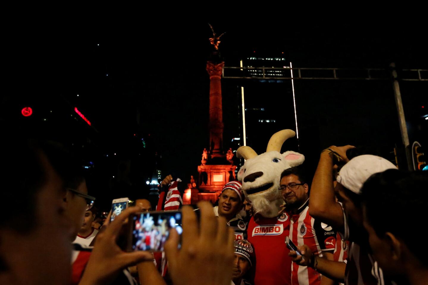 Fans of Chivas de Guadalajara celebrates at the Angel de la Independencia monument after winning the Mexican First Division Final, in Mexico City, Mexico May 28, 2017. REUTERS/Carlos Jasso ** Usable by SD ONLY **