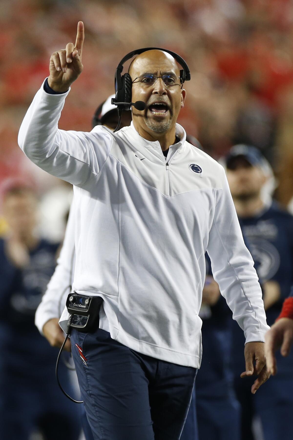 Penn State coach James Franklin signals to his team during a loss to Ohio State 