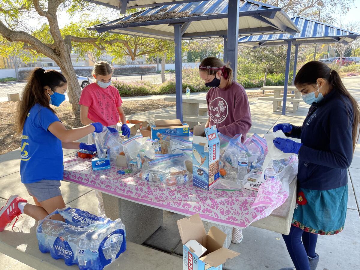 Pacific Trails Middle School Junior Optimists prepared sack lunches for Father Joe's Village.