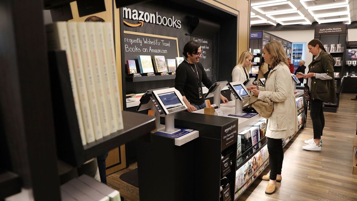 People shop in the Amazon Books in New York City.