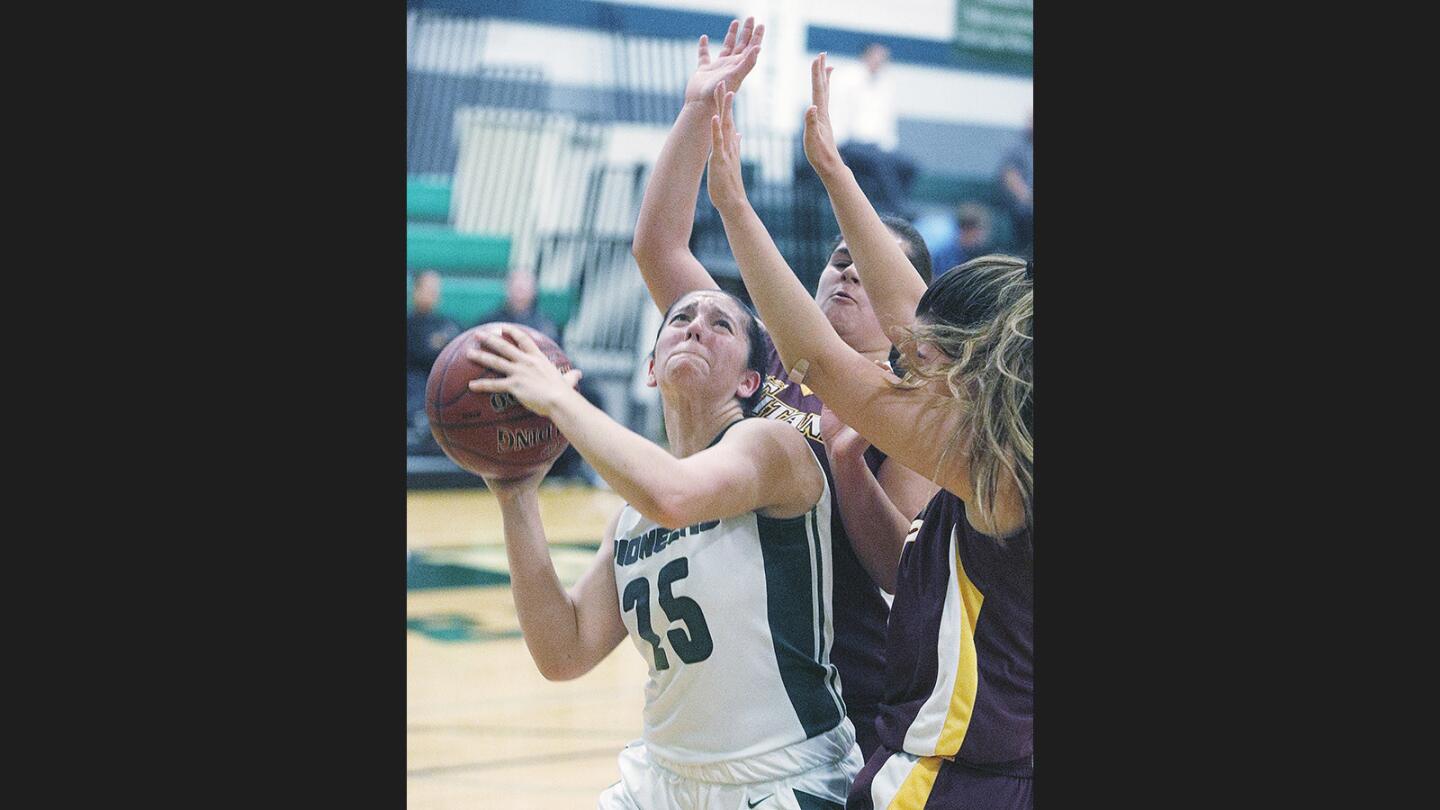 Providence's Sarah Cox battles through multiple Canoga Park Armenian Benevolent General Union players to shoot in the Paul Sutton Tip-Off Classic at Providence High School in Burbank on Wednesday, November 29, 2017.