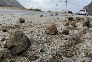 MALIBU CA SEPTEMBER 12, 2024 -Grapefruit-sized rocks are strewn across the shoulder of Kanan Dume Road in Malibu Thursday, Sept. 12, 2024, morning following a 4.7 earthquake centered in the area. There are no reports of damage from the 7:28 am tremblor. (Brian van der Brug / Los Angeles Times)