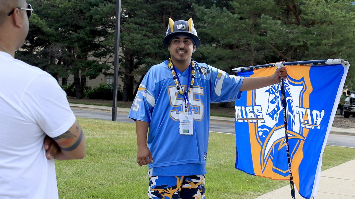 San Diego Chargers fan Johnny Abundez protests outside of the NFL owners meeting at the Hyatt Regency on Tuesday in Schaumburg, Ill.