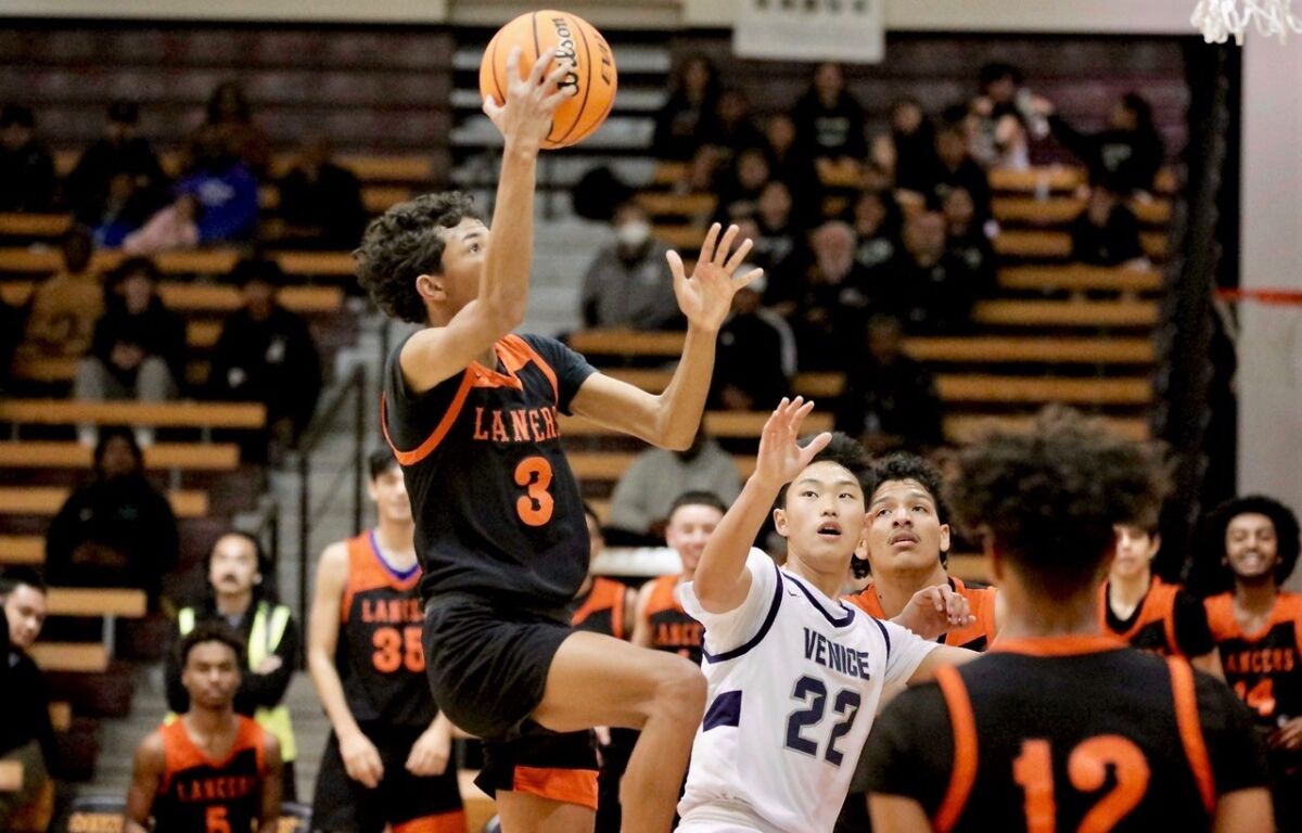 Grant High's Dashaun Gains drives to the basket for two of his 29 points in the City Section Division I final against Venice.