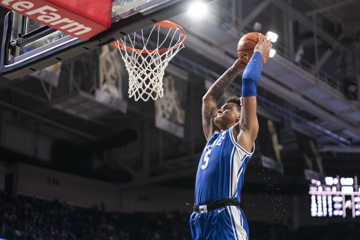 Duke forward Paolo Banchero (5) goes up for a slam dunk during the second half of an NCAA college basketball game against Wake Forest on Wednesday, Jan. 12, 2022, in Winston-Salem, N.C. (AP Photo/Matt Kelley)
