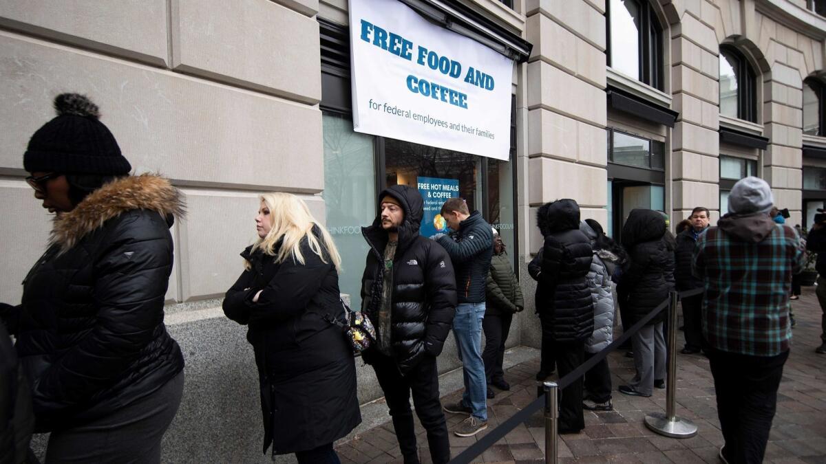 Federal workers line up for a free hot meal at Andres restaurant in Washington, D.C., on Jan. 16 as the partial government shutdown drags on.