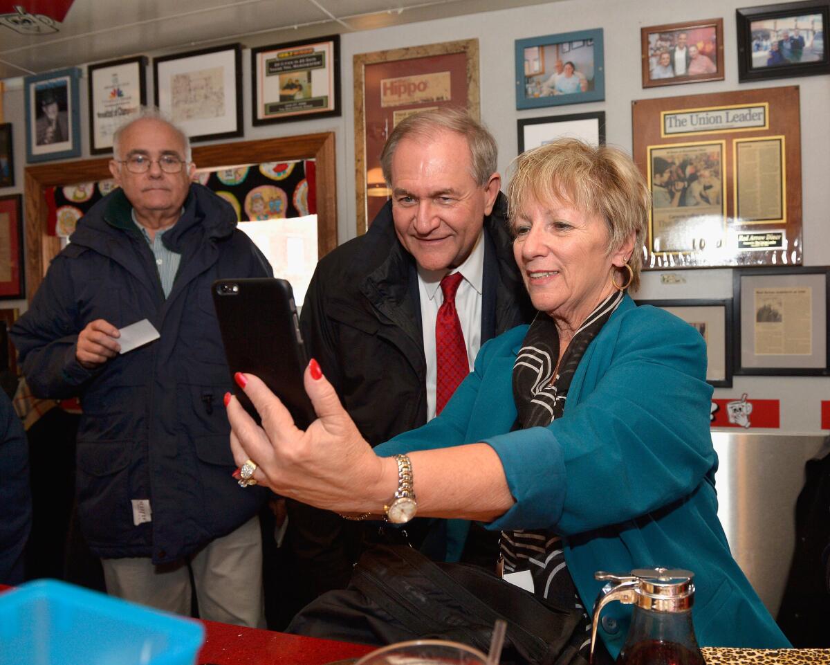 Presidential hopeful Jim Gilmore greets diners in New Hampshire.