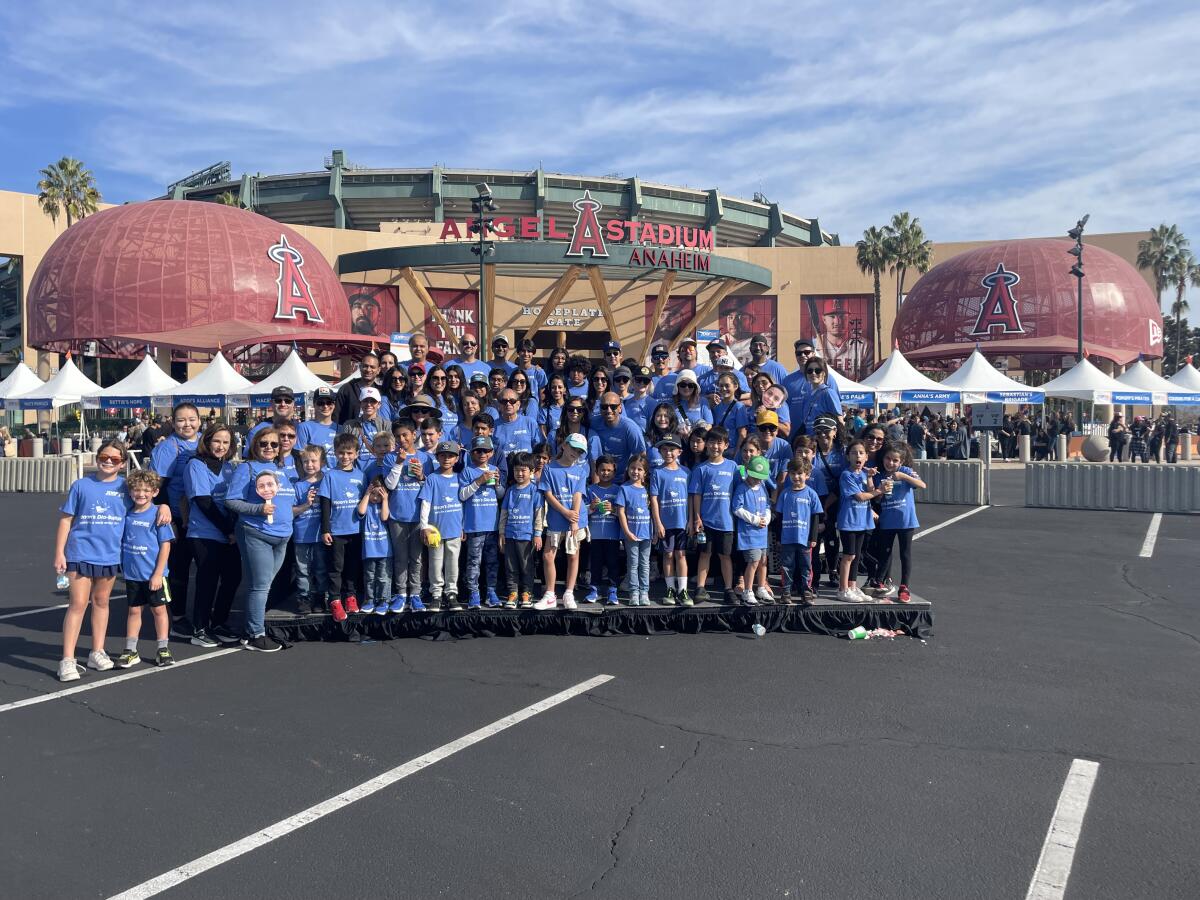 Those included in Riaan's Dia-Bustas team pose for a photo at Angels Stadium in Anaheim.