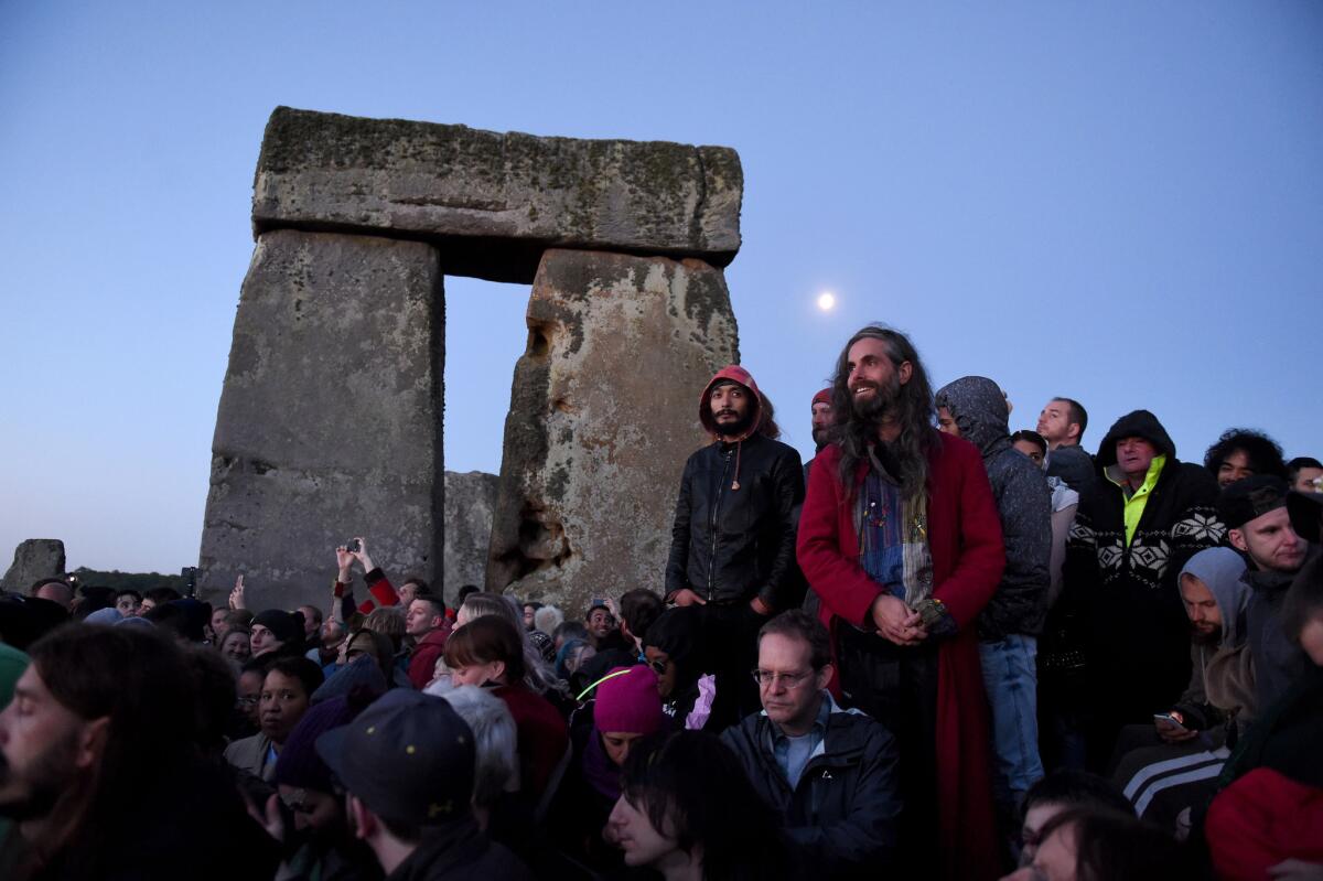 Visitors celebrate summer solstice and the dawn of the longest day of the year at Stonehenge.
