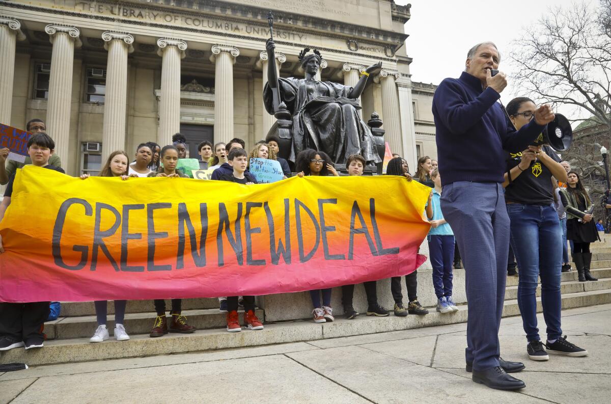 Inslee speaks during a climate change rally at Columbia University in New York.