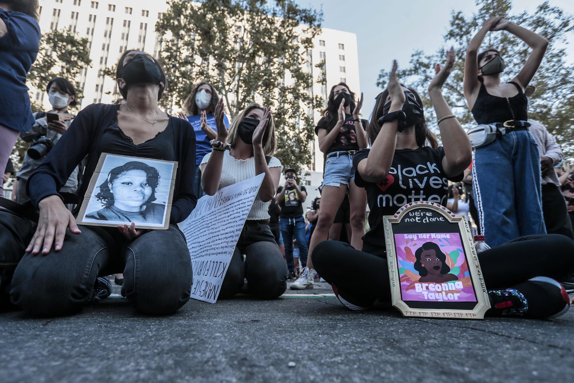 Protesters with images of Breonna Taylor in Los Angeles. 