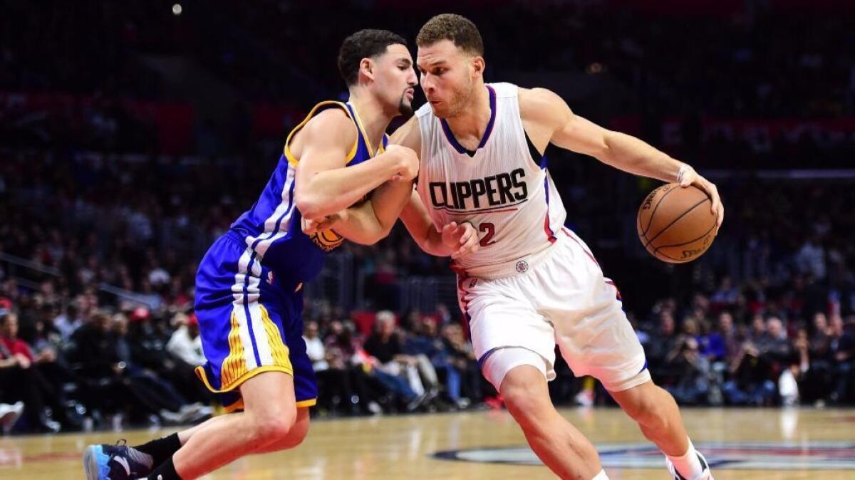 Clippers forward Blake Griffin works against Warriors guard Klay Thompson during a game at Staples Center on Dec. 7.