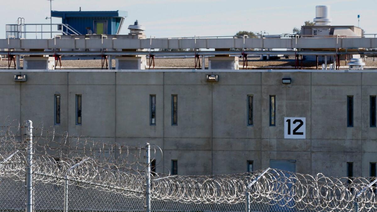 Razor wire surrounds Solano State Prison in the rolling hills near Vacaville.