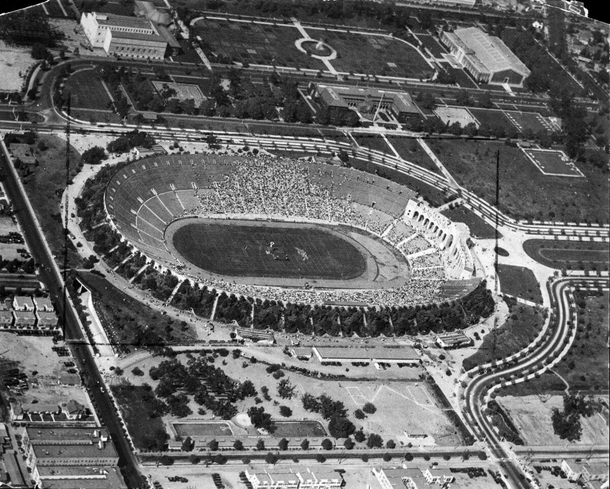 Sept. 20, 1927: An aerial photo shows the Los Angeles Memorial Coliseum filling up with spectators to welcome aviator Charles Lindbergh.