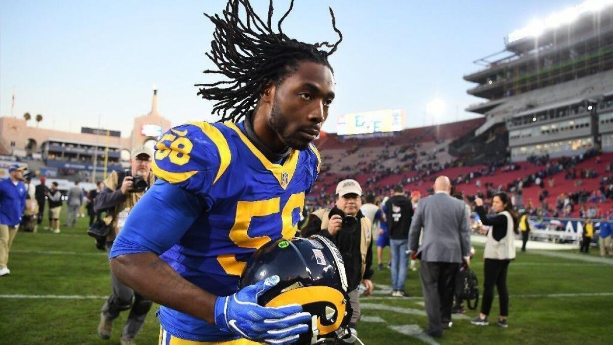 Rams linebacker Cory Littleton jogs off the field after a win over the San Francisco 49ers in December.