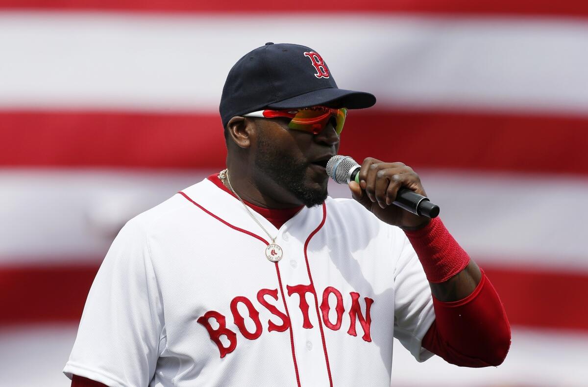Boston Red Sox's David Ortiz speaks to the crowd before a baseball against the Kansas City Royals in Boston on Saturday, April 20, 2013.