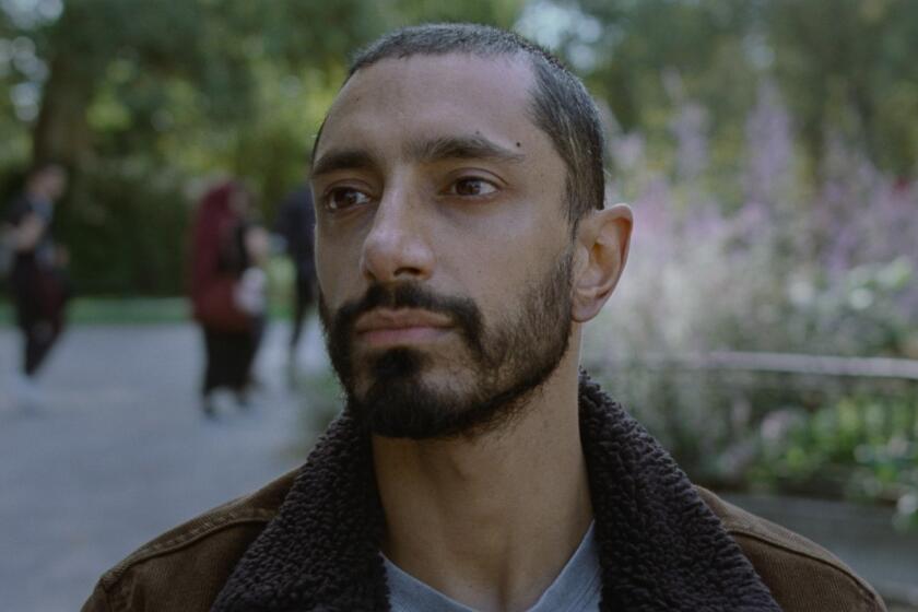 Riz Ahmed sits in silent surrender in "Sound of Metal."