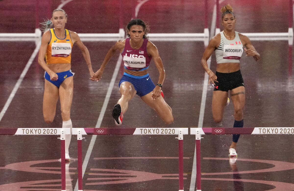 Sydney Mclaughlin wins a women's 400-meter hurdles heat at the Summer Olympics on Monday.