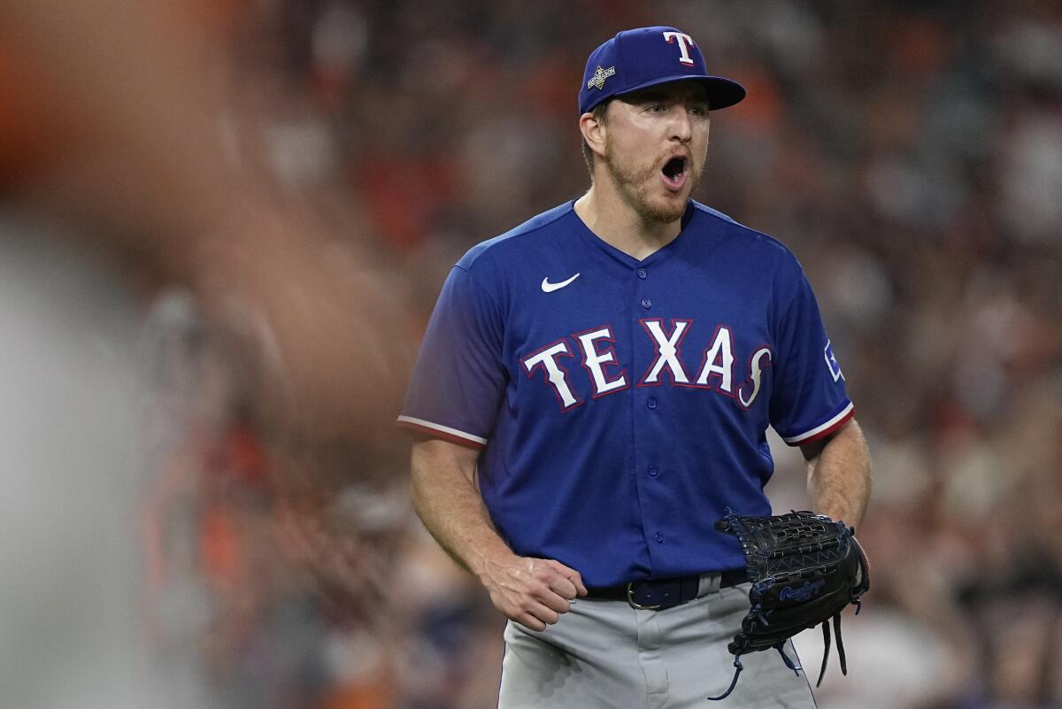 Texas Rangers pitcher Josh Sborz reacts to a double play.