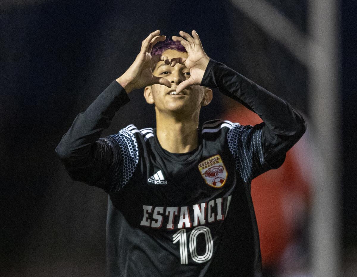 Estancia's Felix Solis gestures to the sideline after scoring against Santa Ana on Jan. 14 in an Orange Coast League match.