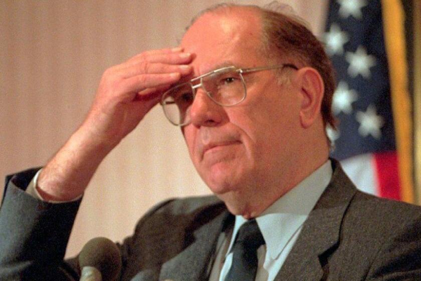 FILE - In this Feb. 3, 1994, file photo, Lyndon LaRouche gestures during a news conference in Arlington, Va.. (AP Photo/Joe Marquette, File)