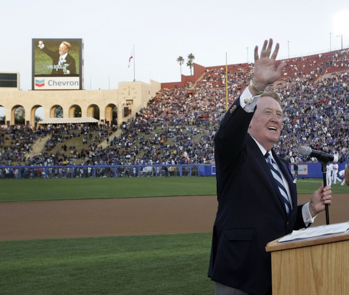 Vin Scully acknowledges the crowd after receiving a standing ovation before a game between the Dodgers and Boston Red Sox at the Coliseum in March 2008.