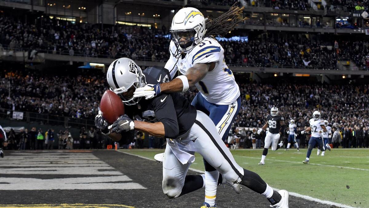 The Chargers' Jahleel Addae breaks up an end zone pass intended for Oakland's Andre Holmes on Dec. 24.