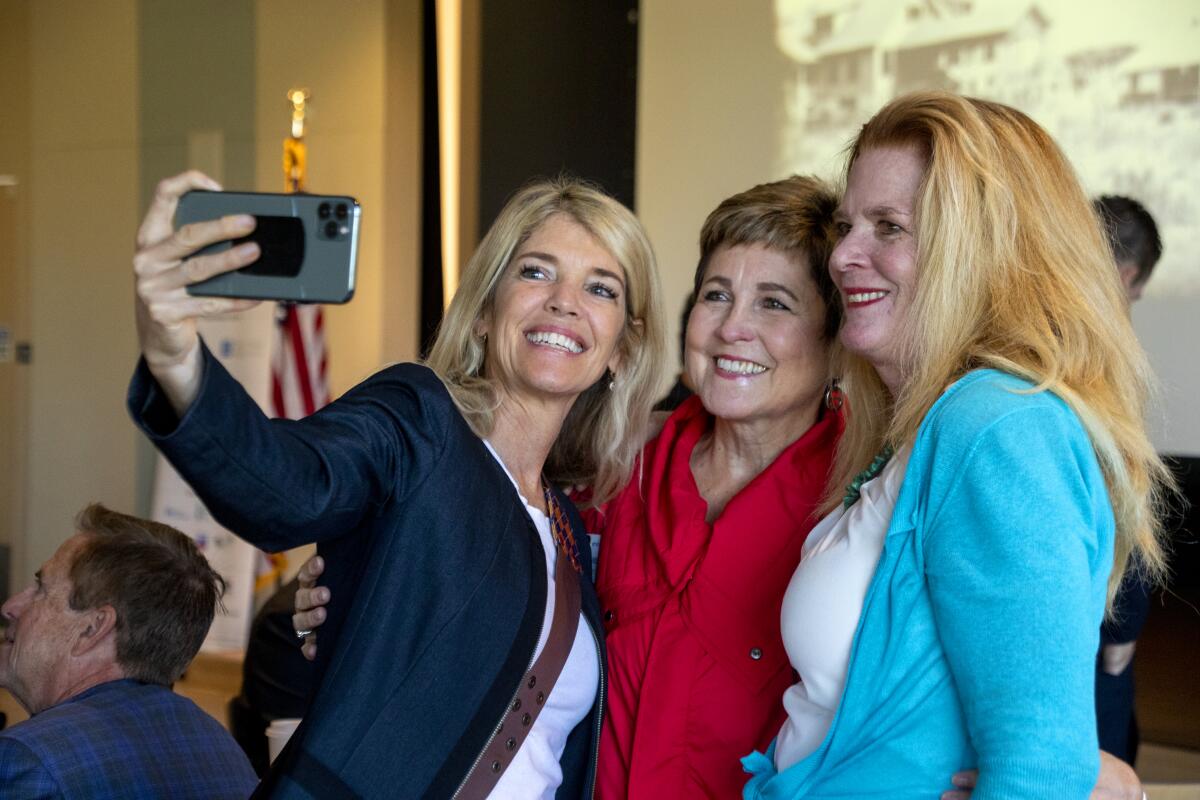 Mayor Pro Tem Barbara Delgleize, center, poses for a selfie Monday.
