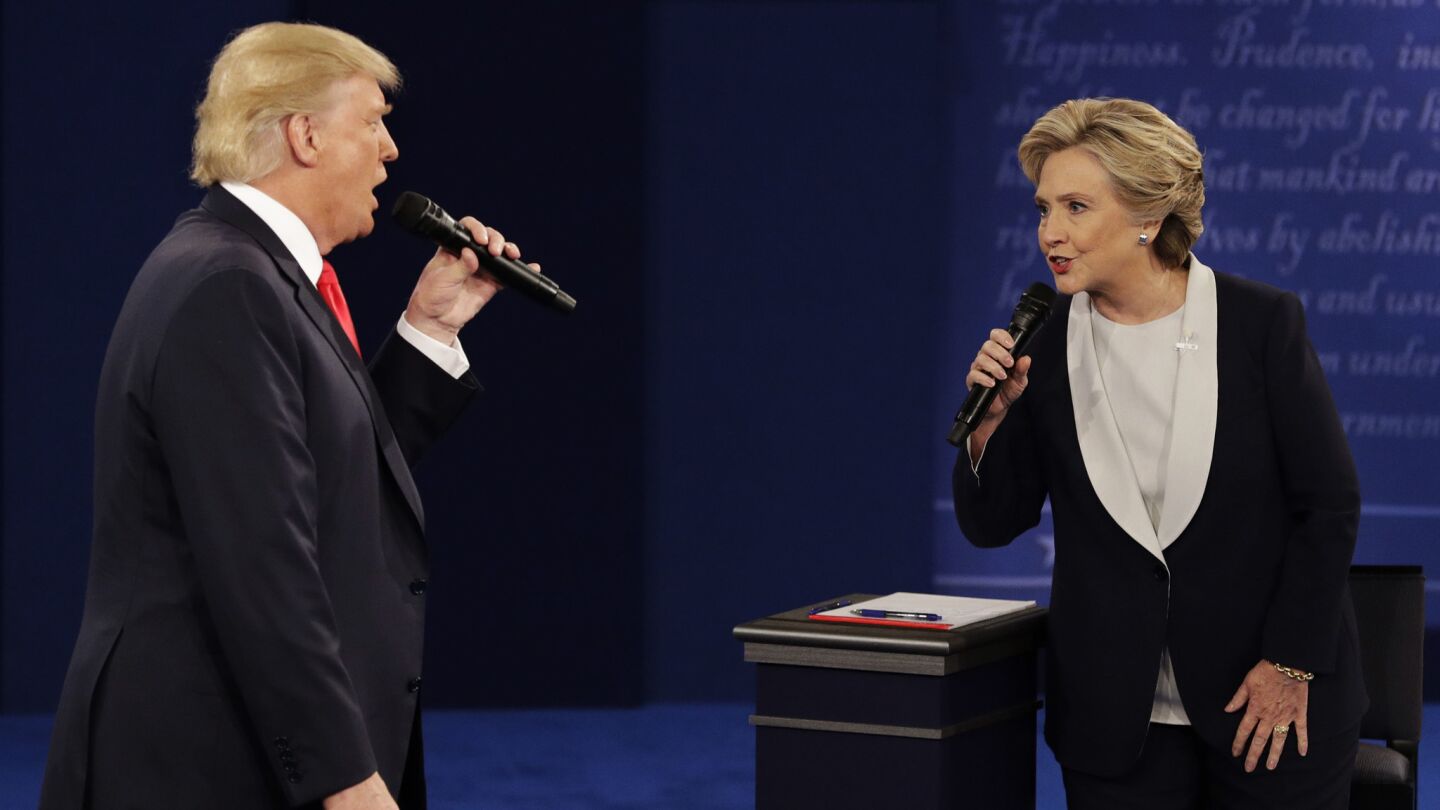 Donald Trump and Hillary Clinton speak during the second presidential debate.