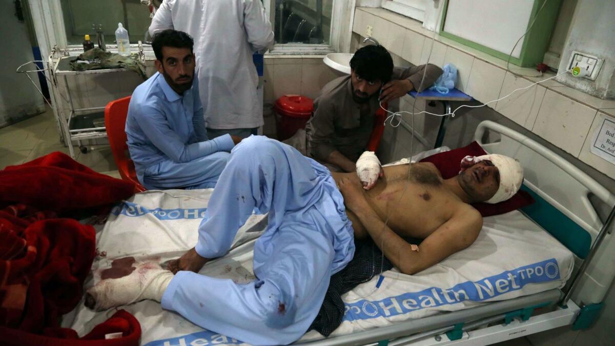 A man wounded in a suicide bombing in Jalalabad, in eastern Afghanistan, is treated at a hospital.