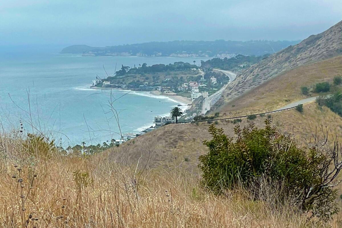 A trail goes along the coast and up into the hills.