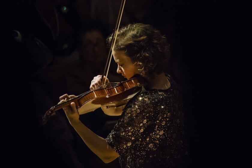 LOS ANGELES, CALIF. -- SUNDAY, DECEMBER 3, 2017: Violin soloist Hilary Hahn is seen performing to 'Serenade' (after Plato???????s ???????Symposium???????) by composer LEONARD BERNSTEIN, with the LA Philharmonic in Los Angeles, Calif., on Dec. 3, 2017. (Marcus Yam / Los Angeles Times)