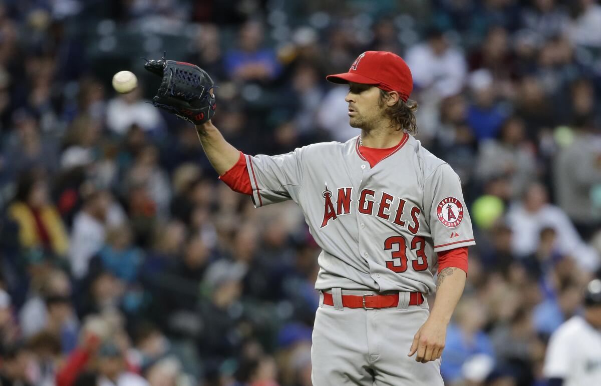 C.J. Wilson held the Mariners to just two hits over eight innings in the Angels' 2-0 victory in Seattle on April 7.
