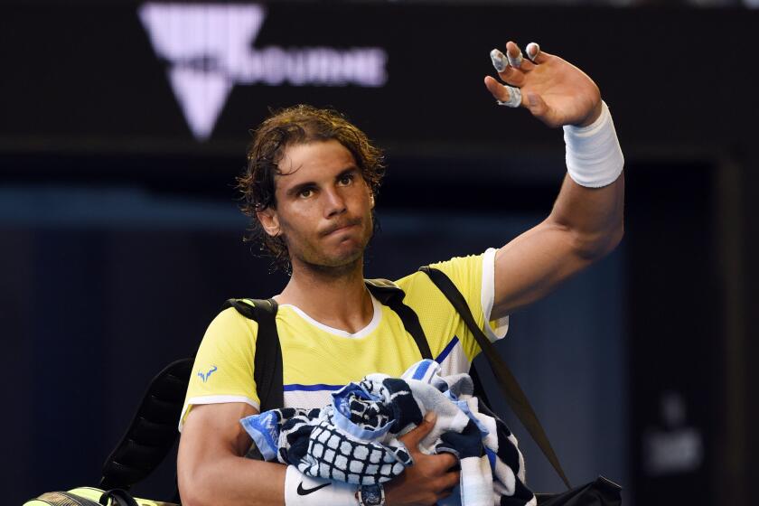 Rafael Nadal of Spain leaves the court after being knocked out by Fernando Verdasco in a first round match at the Australian Open on Jan. 19.