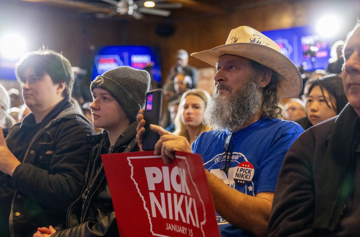  Resident Jon Hathaway joins other supporters at a campaign event for Nikki Haley at Jethro's BBQ.