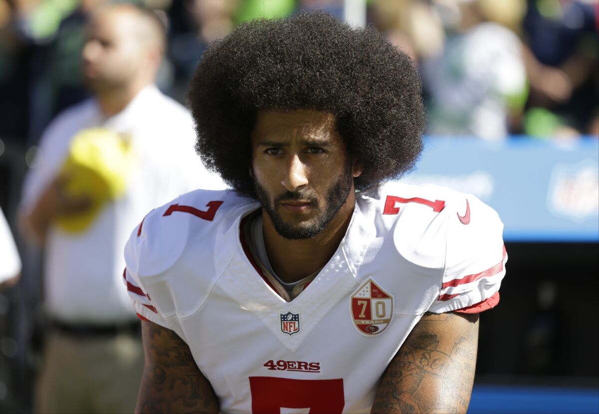 Colin Kaepernick kneeling during the national anthem with the San Francisco 49ers in 2016.