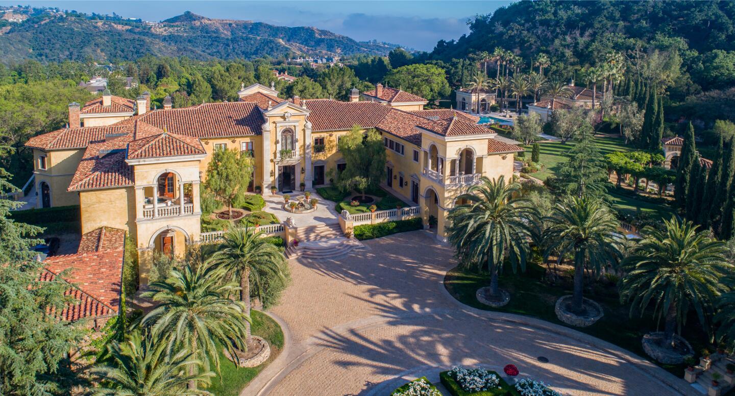 Built in 1998, the estate combines three lots across nearly 10 acres and centers on an Italian-inspired mansion.