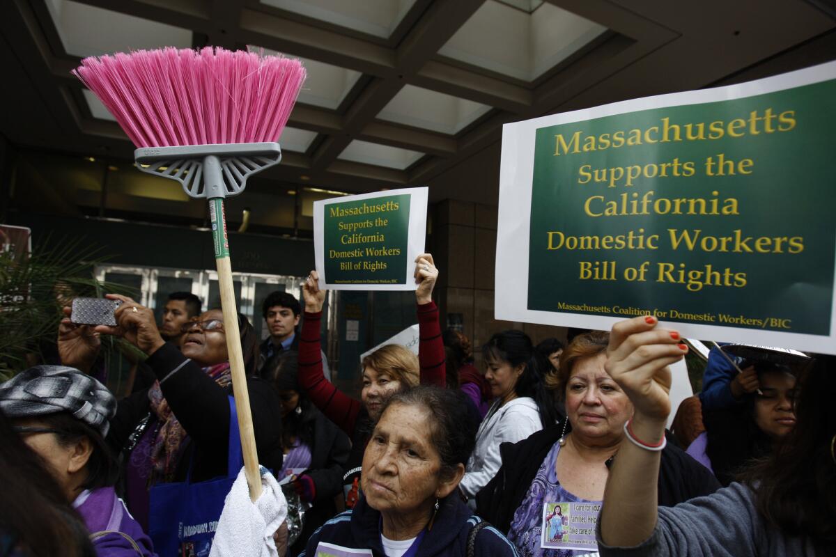 Domestic workers and community leaders from California and across the country rallied in downtown Los Angeles in March in support of AB 241, which extends eligibility for overtime pay to domestic workers. Gov. Jerry Brown signed the measure Thursday.
