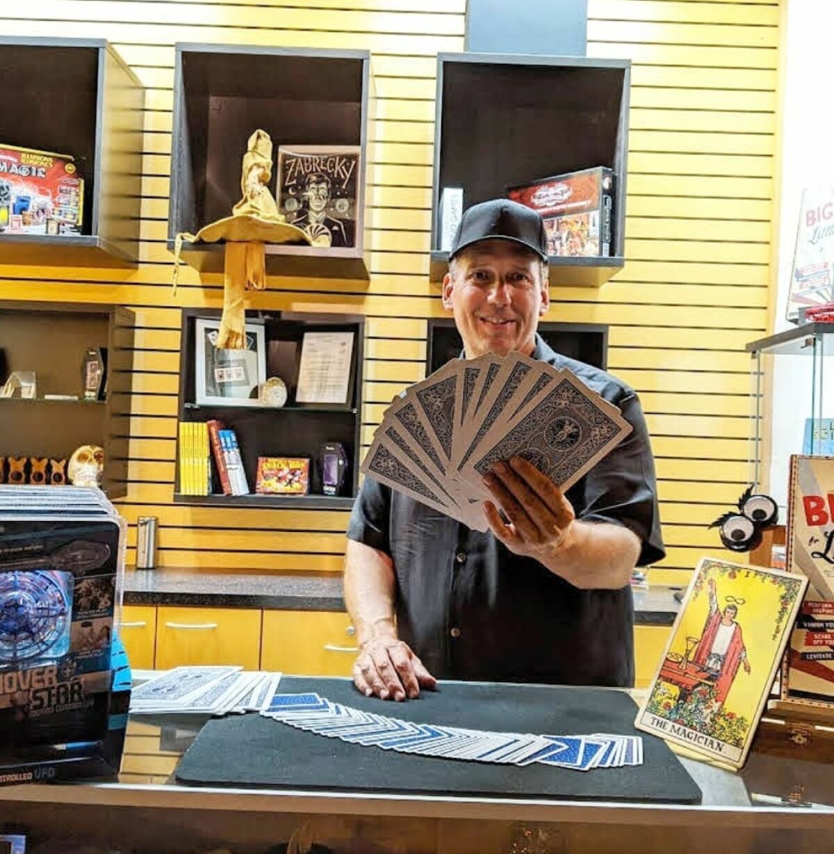 La Jolla resident Craig Blackwood demonstrates a card trick at La Jolla Magic on Herschel Avenue.