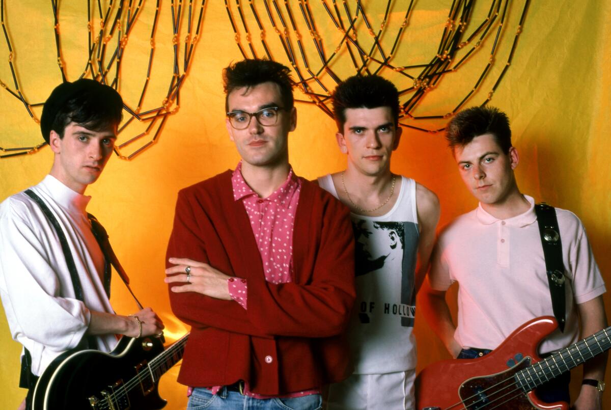 Four members of a British rock band in the 1980s